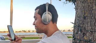 Our reviewer testing ANC and call quality on the Bose 700