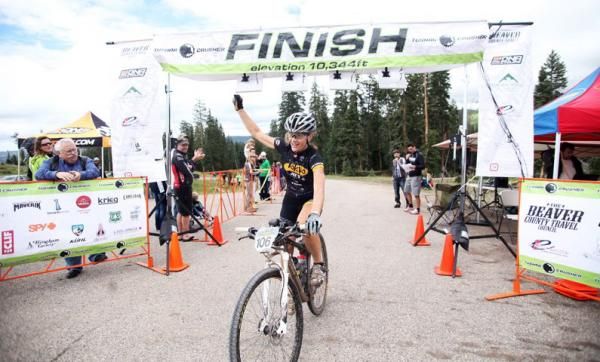 Gretchen Reeves crosses the line on a course record-breaking ride.