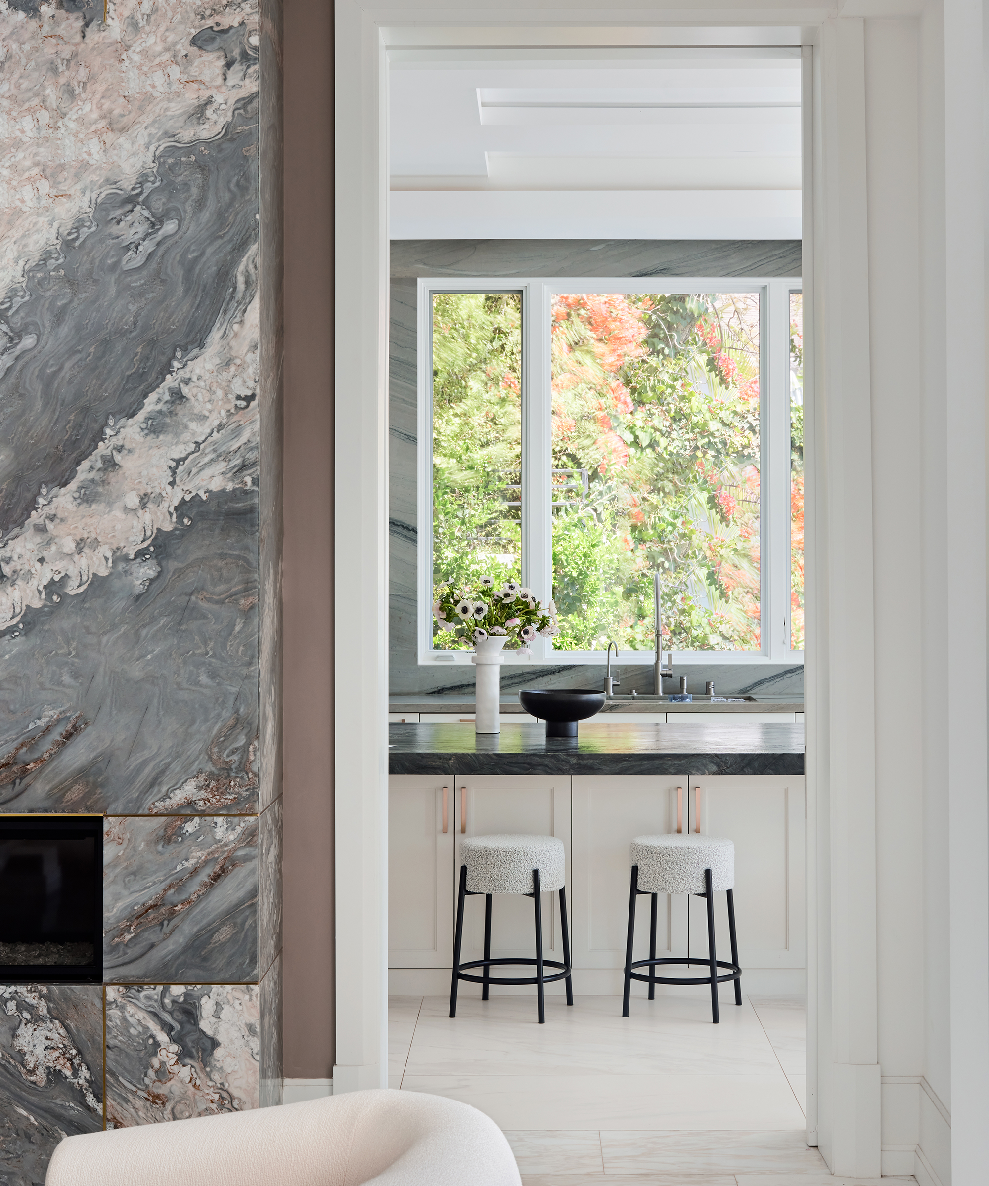 marble fireplace next to a doorway