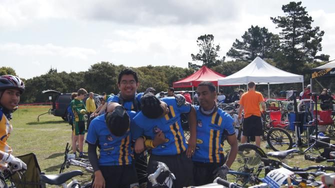 DeShaun Smith (right) a student-athlete who has overcome the difficulties of cerebral palsy to compete in mountain bike races, enjoys the camaraderie he finds in his high school cycling team.