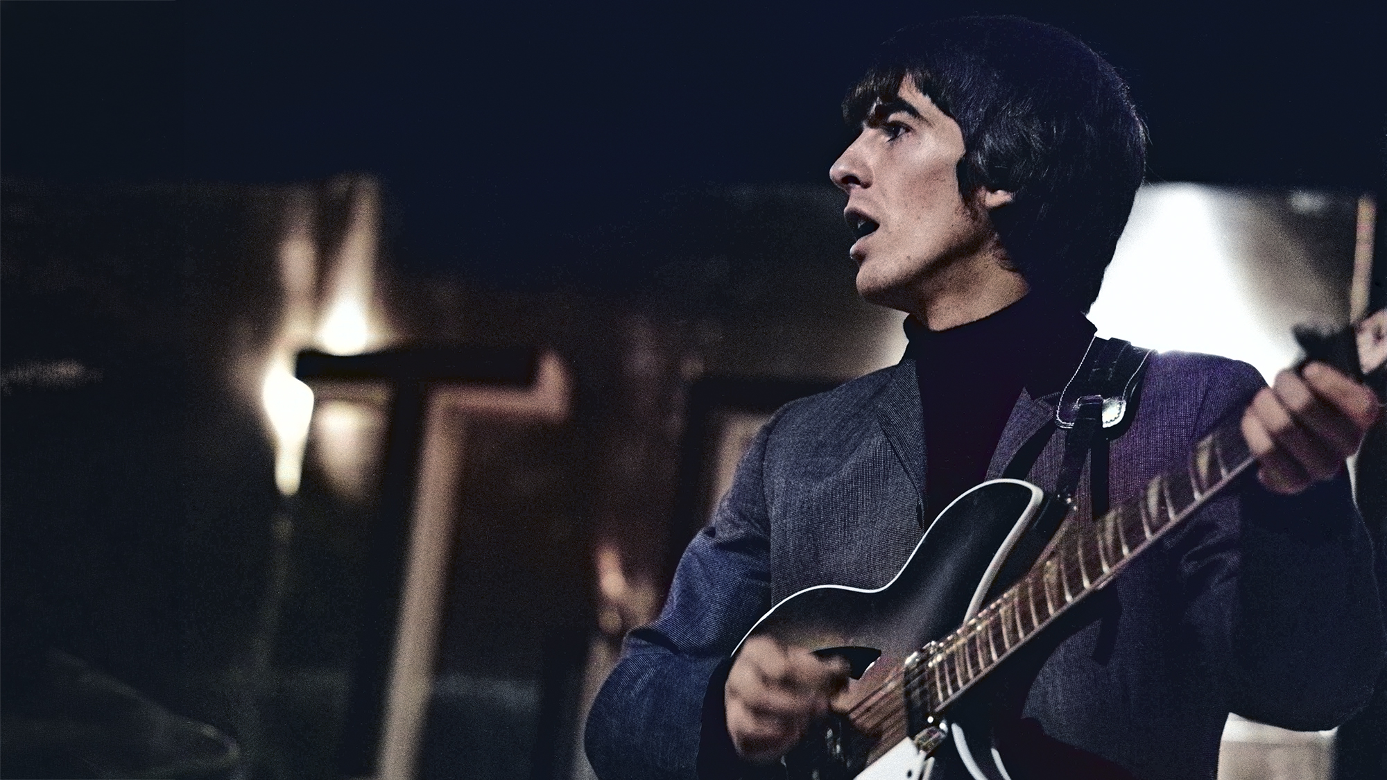 George Harrison plays his 1963 Rickenbacker 360/12 guitar on stage during rehearsals for the TV show 'Thank Your Lucky Stars' Summer Spin at Teddington Studios in London on 11th July 1964.