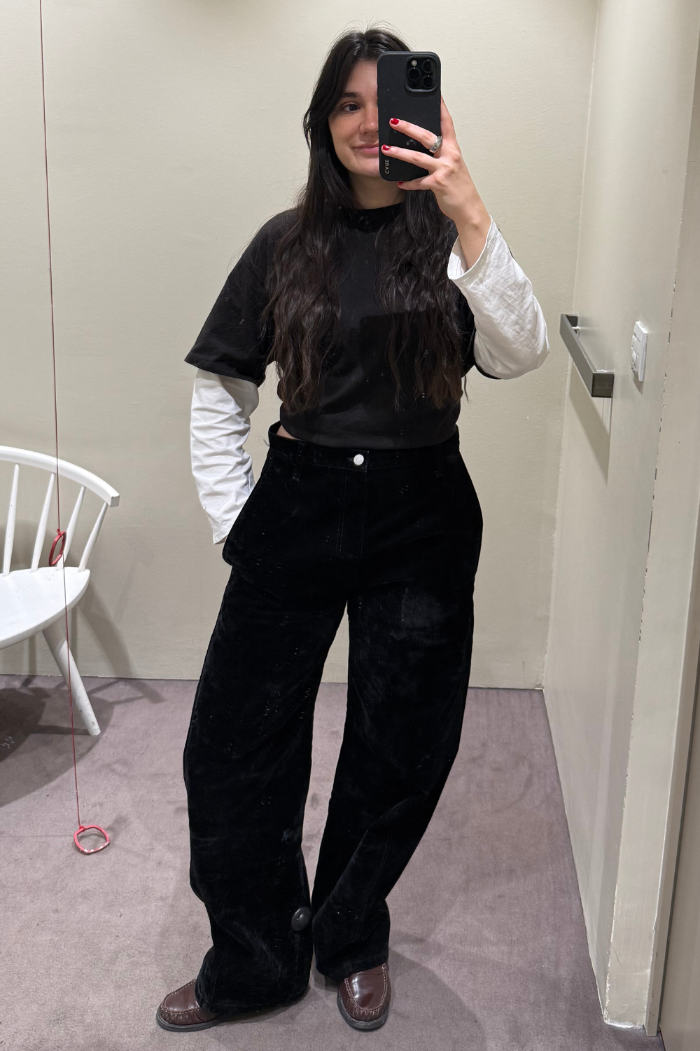 Sofia Piza wearing black barrel leg jeans