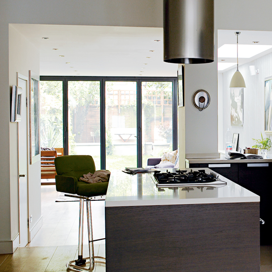 kitchen area with glass door and marble countertop
