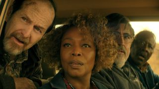 Wally, Judy, Sam and Art all looking through passenger window in Art's vehicle in The Boroughs