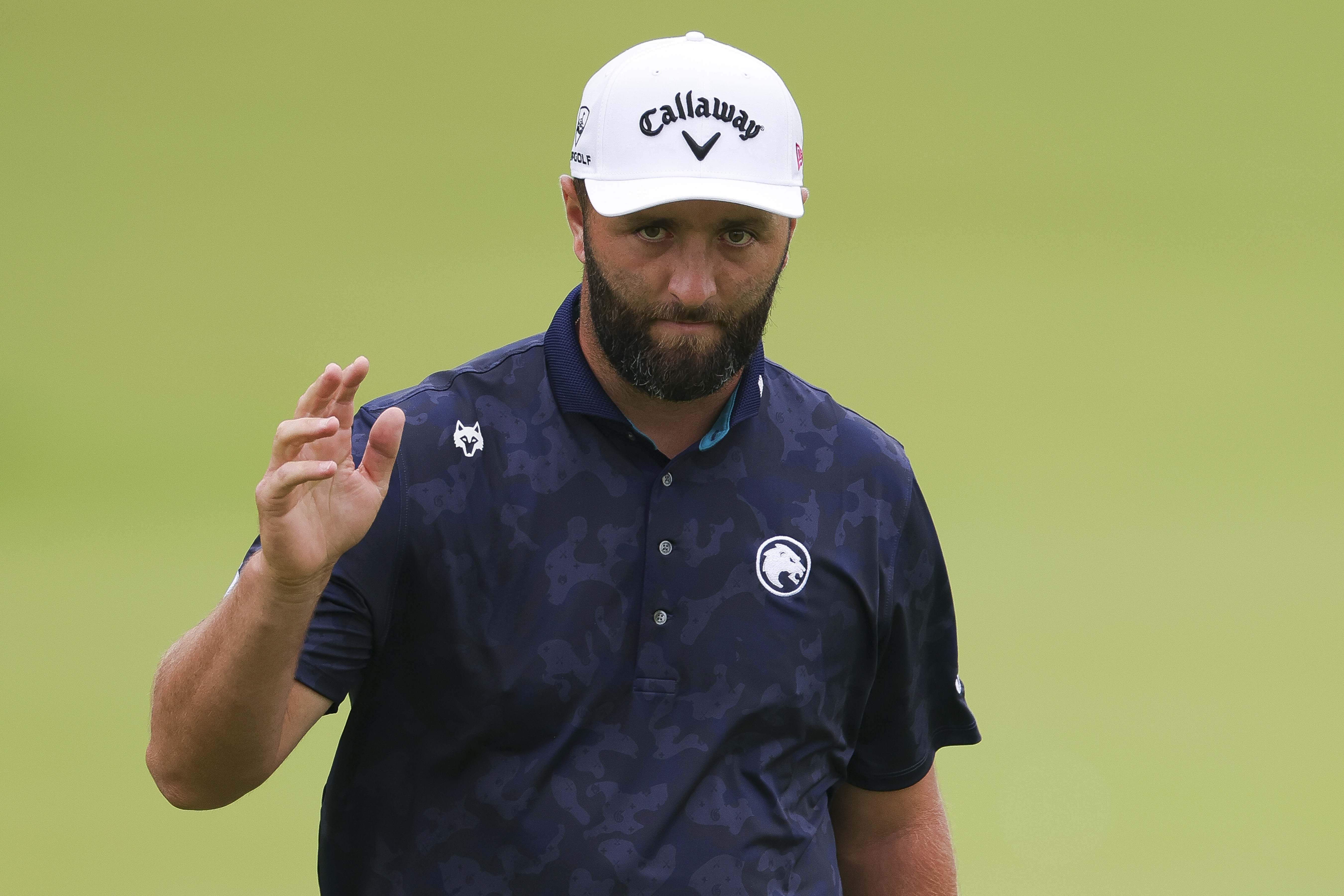 Jon Rahm waves to the crowd