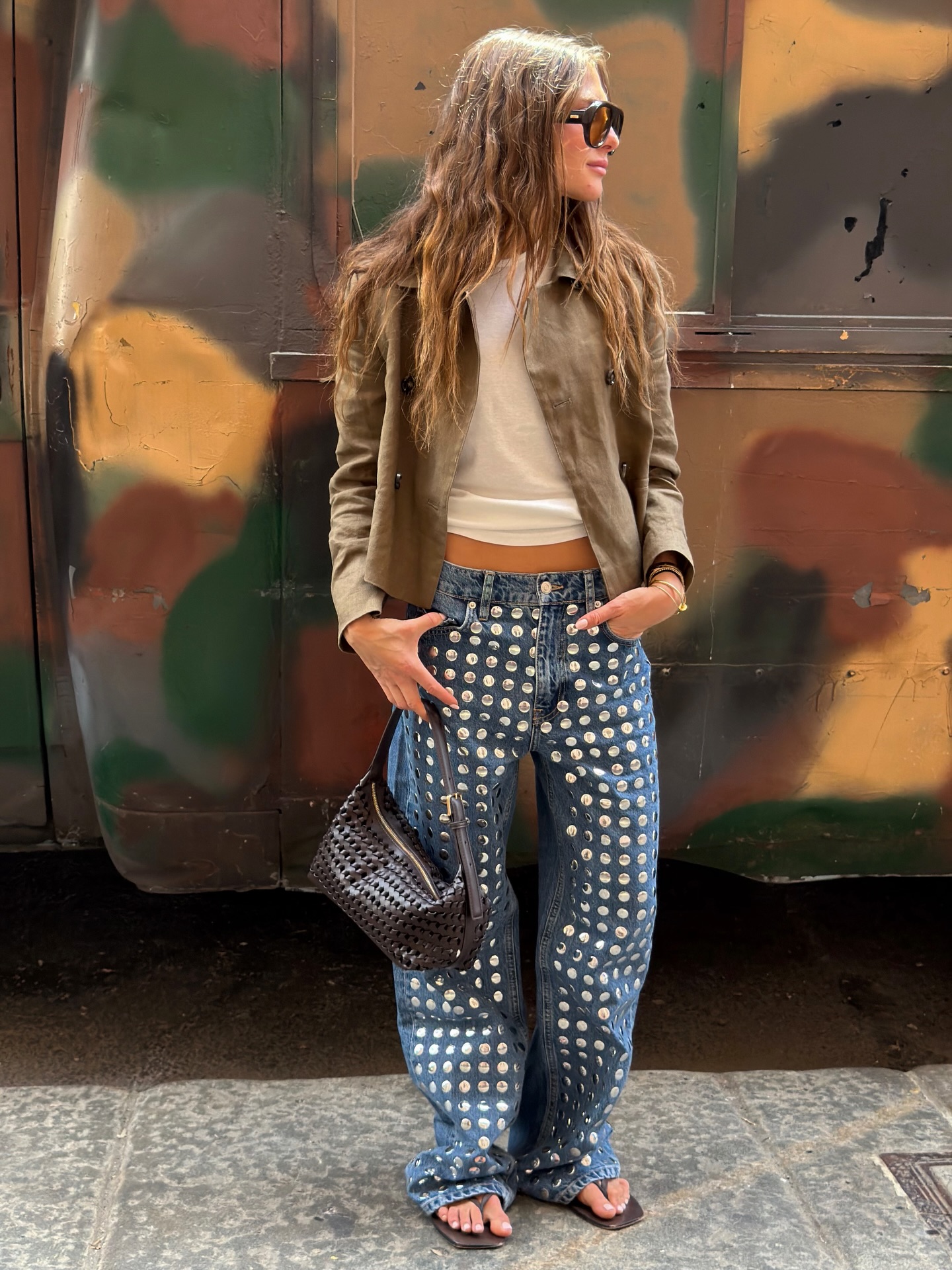 Fashion person wearing embellished jeans.