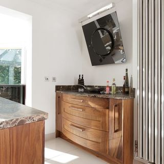 kitchen with wooden drawer and black extractor hood