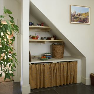 alcove with rattan storage basket and drawers