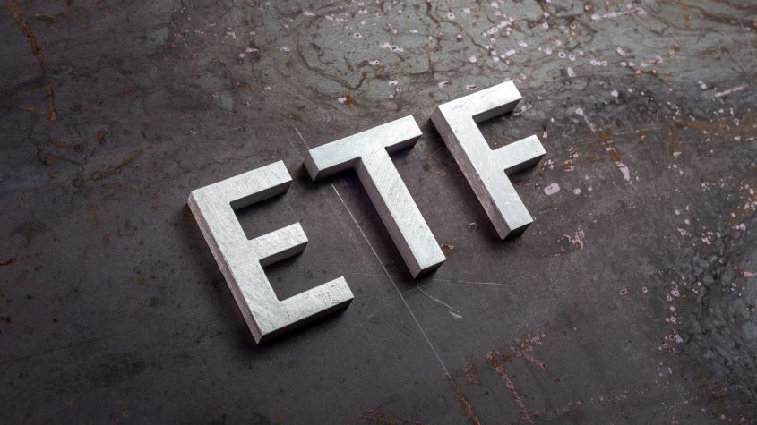 High Angle View Of ETF Text On Table 