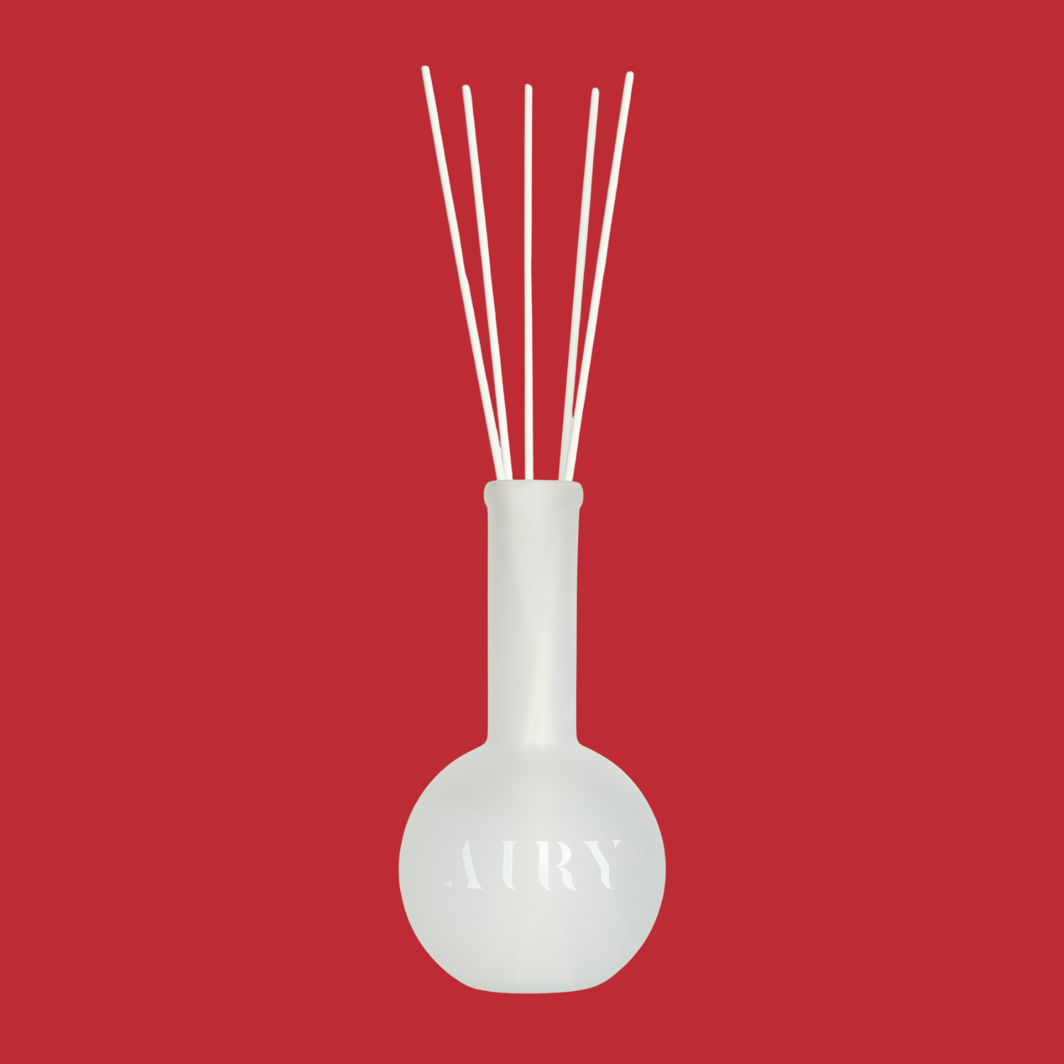 A frosted glass reed diffuser