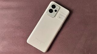 Realme GT 2 Pro review: green phone on grey fabric