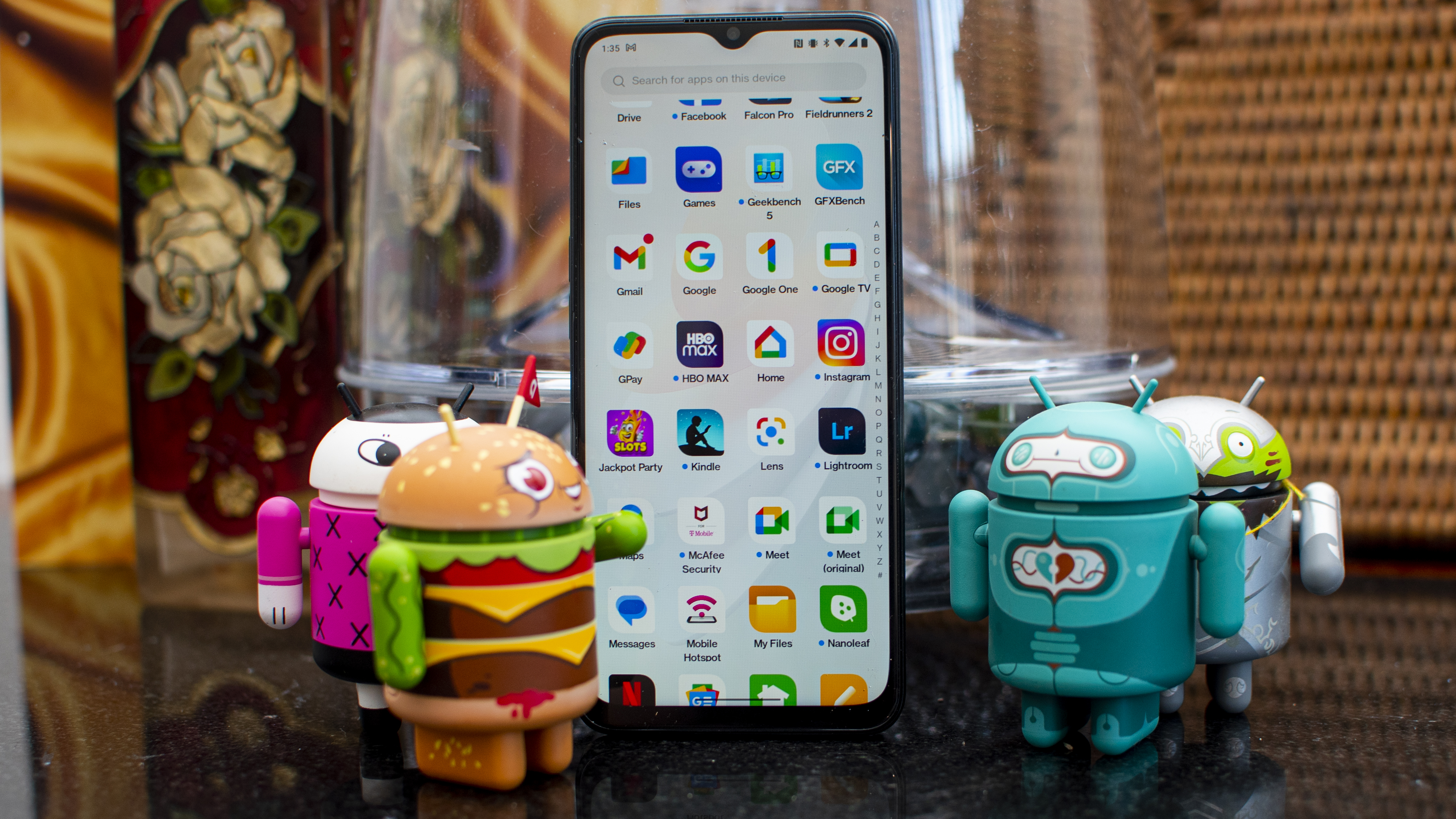 OnePlus Nord N300 5G posing with Android figurines