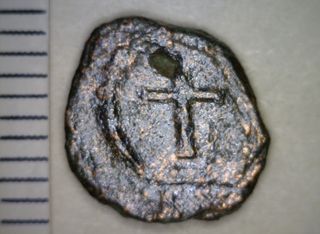 One of the coins found in the hoard shows a cross within a wreath. It was minted sometime between A.D. 425-450.