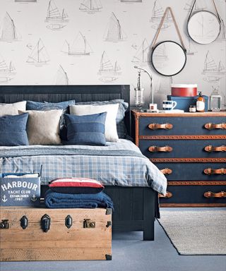 nautical bedroom with boat-print wallpaper