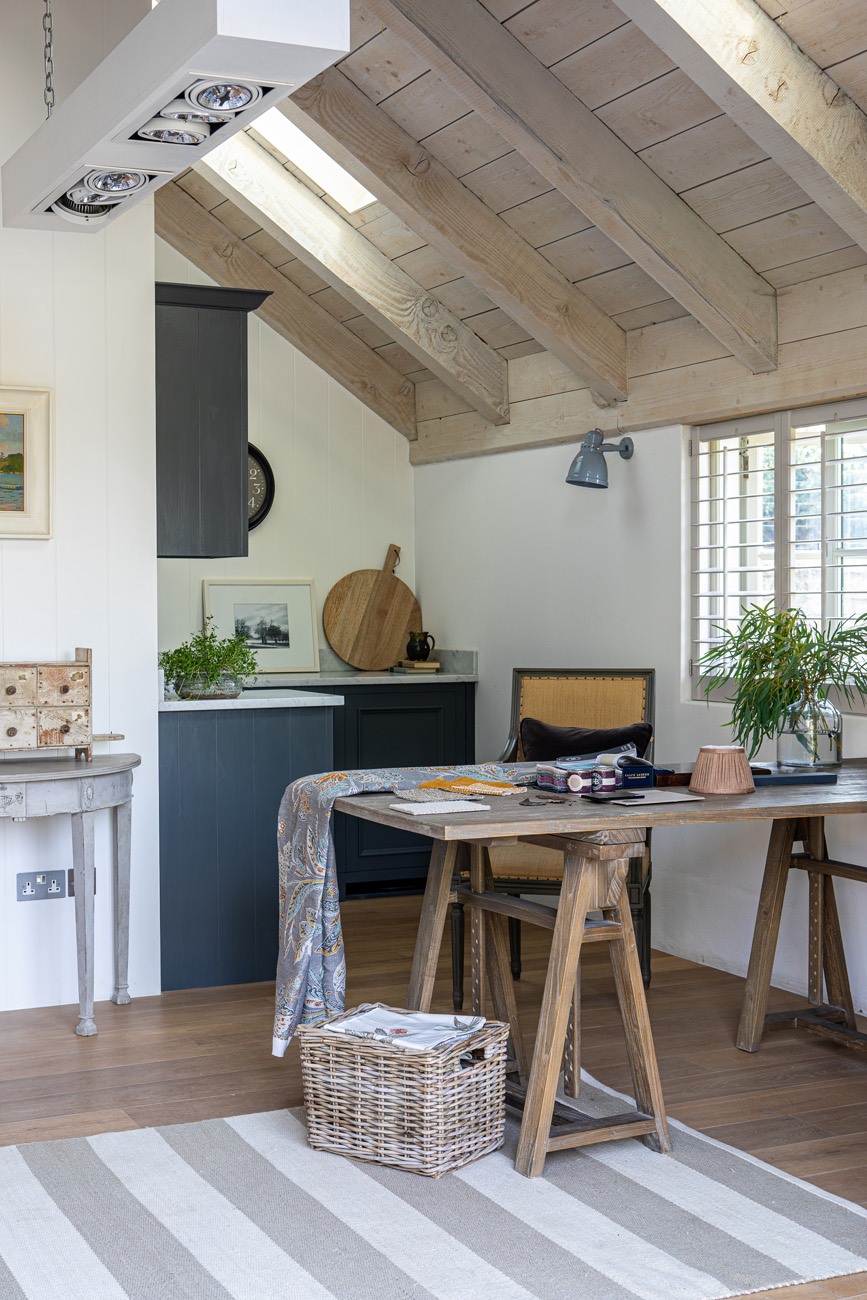 Office in rustic shed with workshop desk and natural light
