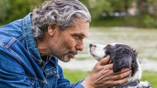 Senior man talking to his dog