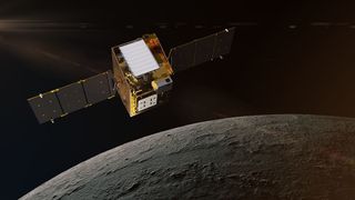 a gold-foil-covered cube-shaped satellite with a white panel and dual three-paneled solar panels floats in black space high above the grey rocky curve of the moon.