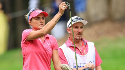 Lexi Thompson and her caddie Mark Wallington look on at the 2024 KPMG Women&#039;s PGA Championship