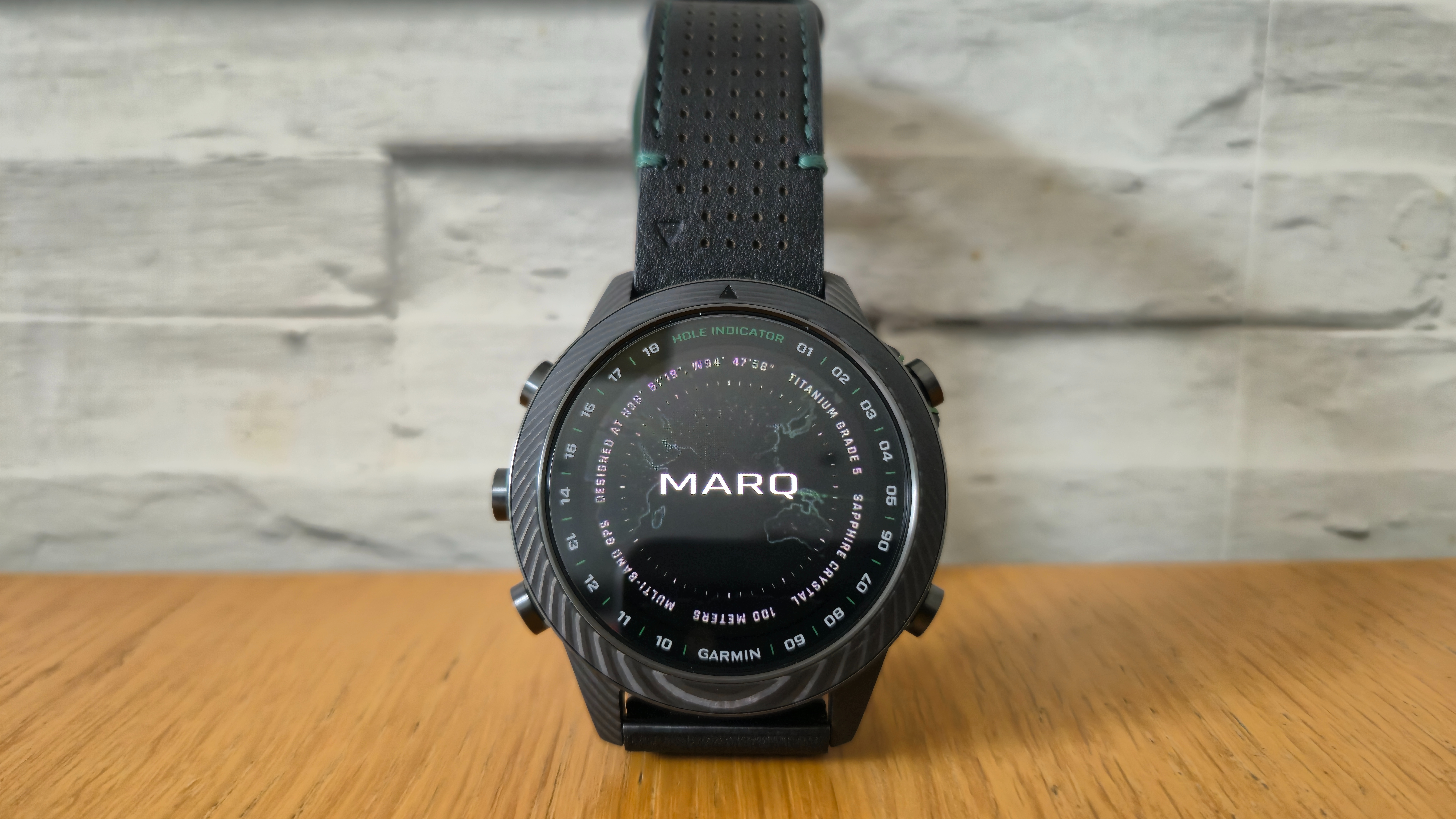 The Garmin MARQ Golfer (Gen 2) on a wooden surface