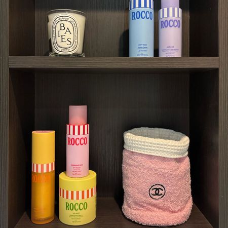 A bathroom shelf featuring Rocco Beauty products