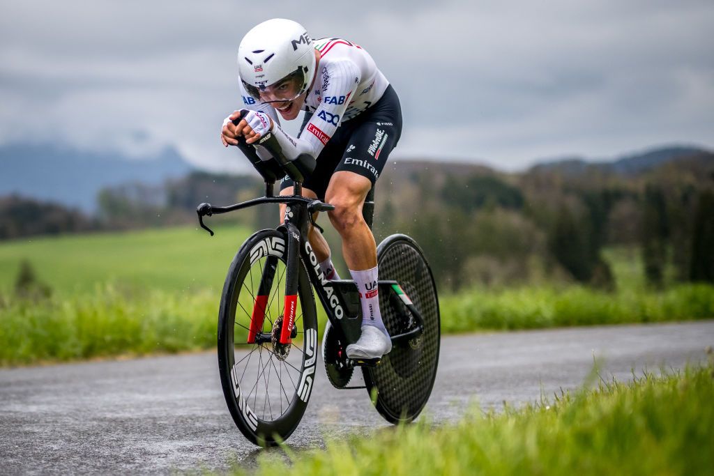 UAE Team Emirates's Spanish rider Juan Ayuso cycles during the third stage of the Tour of Romandy UCI cycling World tour, a 15,5 km time trial starting and finishing in Oron, in Maracon, western Switzerland, on April 26, 2024. (Photo by Fabrice COFFRINI / AFP)