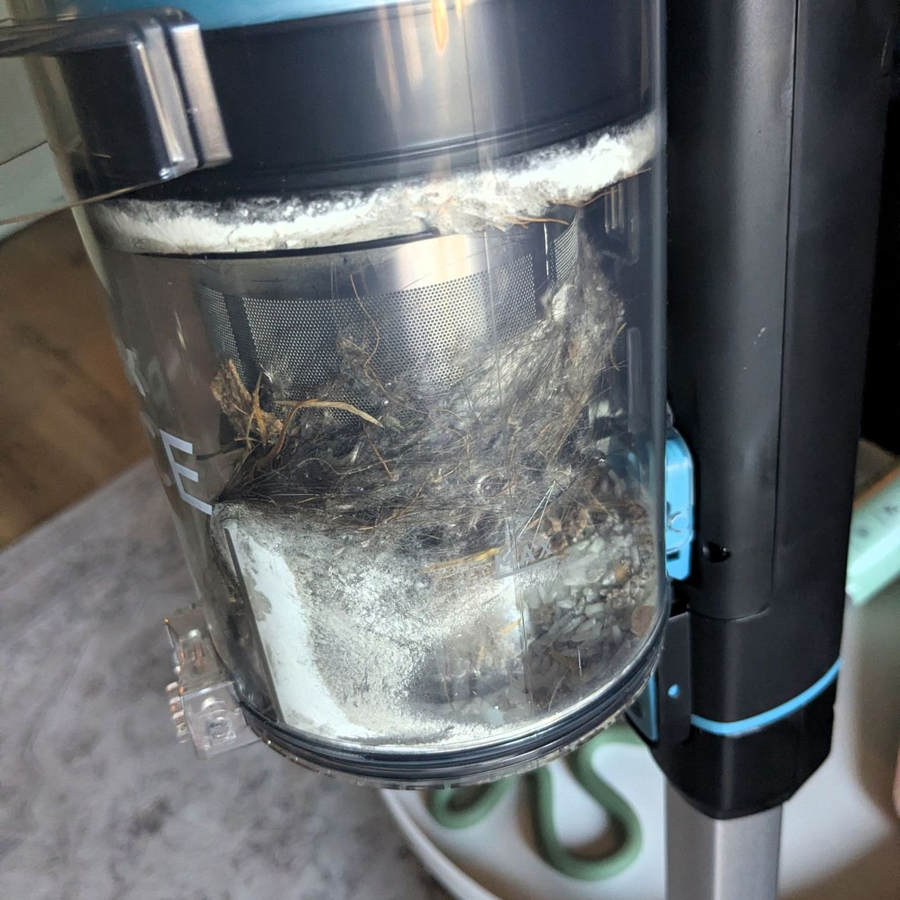 VAX Pace Plus Cordless Vacuum Cleaner with a filled dustbin