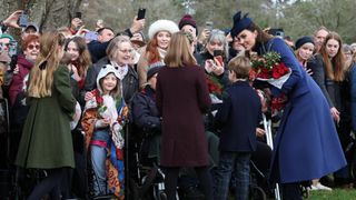 Catherine, Princess of Wales, Prince Louis of Wales, Mia Tindall and Princess Charlotte of Wales chat with well-wishers after attending the Royal Family's traditional Christmas Day service in 2023