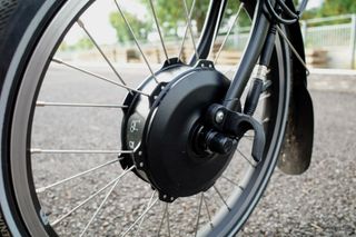 The hub motor mounted in the front wheel of an electric Brompton
