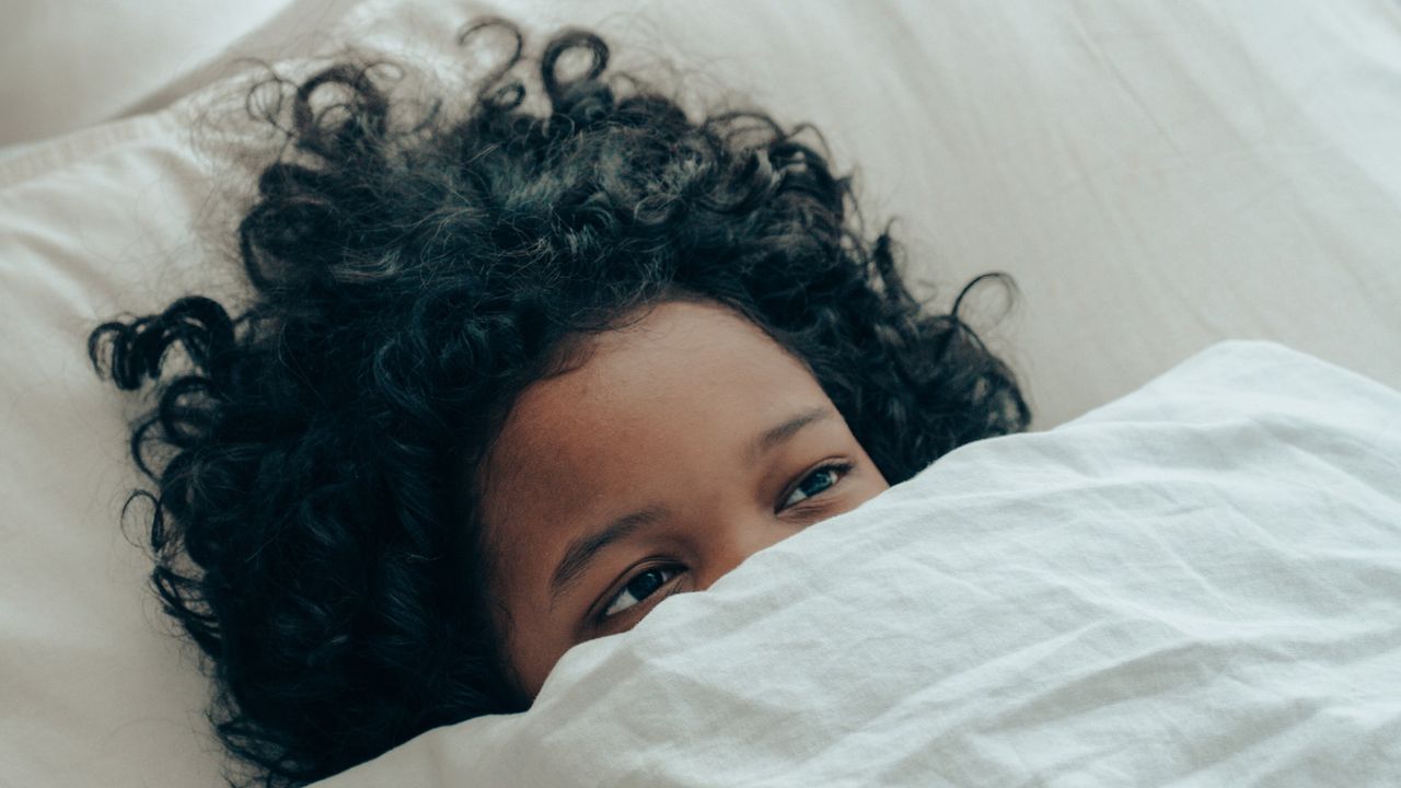 Woman awake in bed