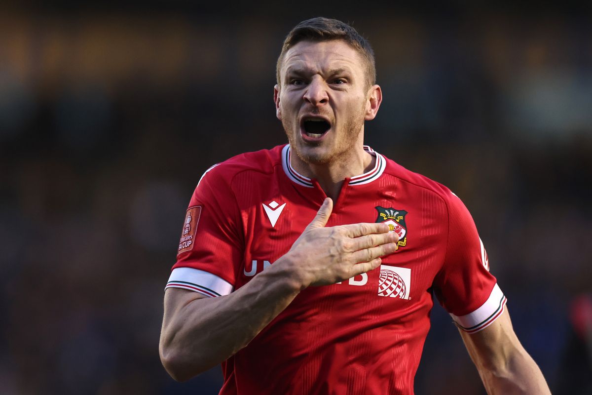 Paul Mullin of Wrexham celebrates the win at the final whistle during the Emirates FA Cup Third Round match between Shrewsbury Town and Wrexham at New Meadow on January 07, 2024 in Shrewsbury, England.