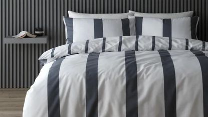 La Redoute blue striped bedding set with panelling behind
