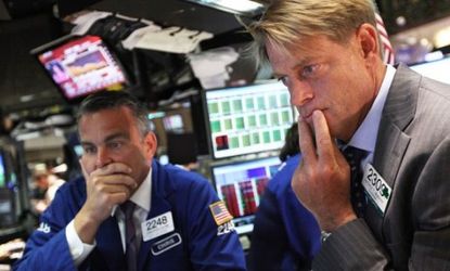 Traders work on the floor of the New York Stock Exchange Thursday, when the stock market had its worst one-day plunge in years.