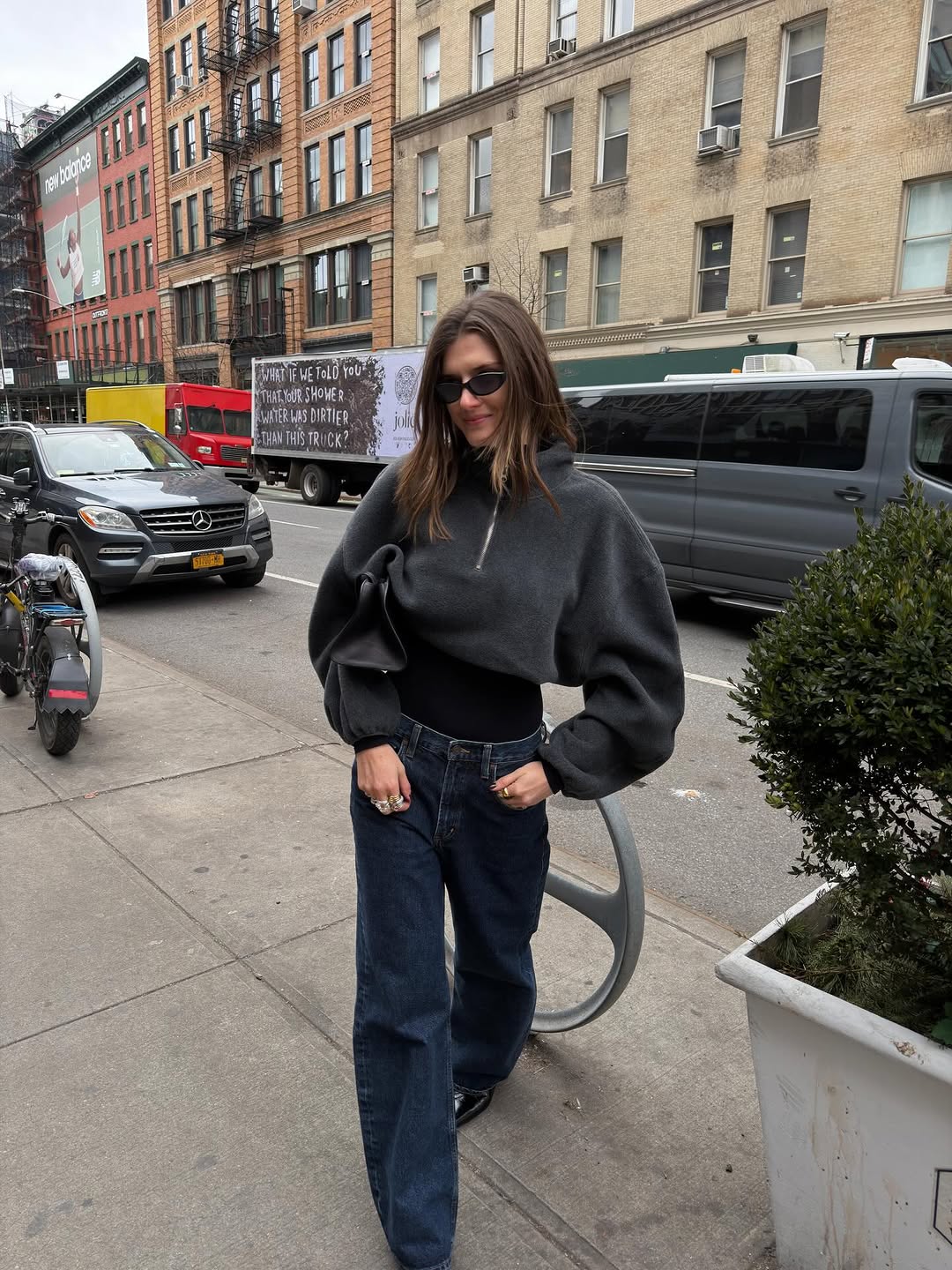 woman wearing gray sweater spring outfit 2026