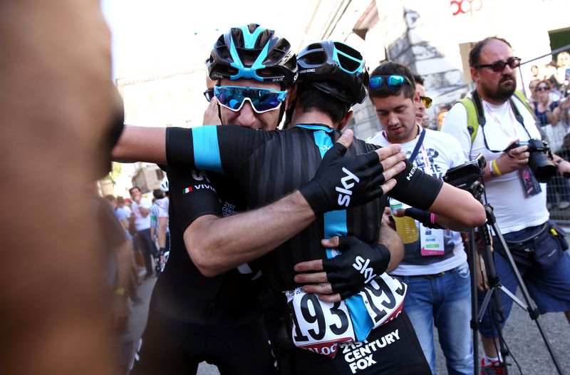 Elia Viviani celebrates victory with Team Sky teammate Sergio Henao