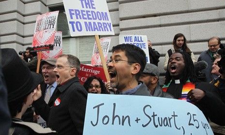 People celebrate outside a San Francisco court Wednesday after a three-judge panel ruled that a voter-approved ban on same-sex marriage violated the civl rights of gays and lesbians.