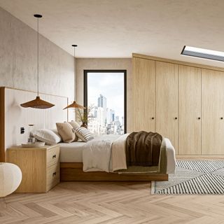 Wooden wardrobe in bedroom with sloping ceiling
