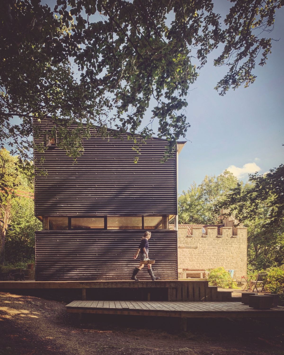 Originally designed to feel as if they were camping in the treetops, the first floor now features less glazing than the original design. The old folly was also recently completed after years of renovating and provides as cosy master bedroom for Piers and Sue.