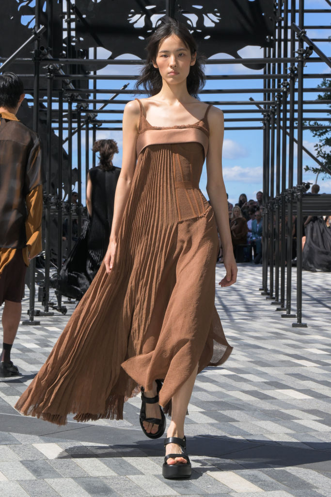 Woman wearing brown dress