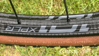 Closeup of Zipp 101 XPLR gravel wheel on grass