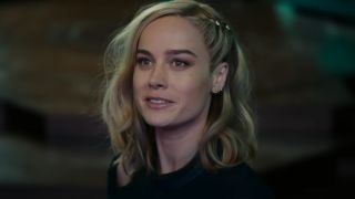 Brie Larson as Captain Marvel, smiling in The Marvels.