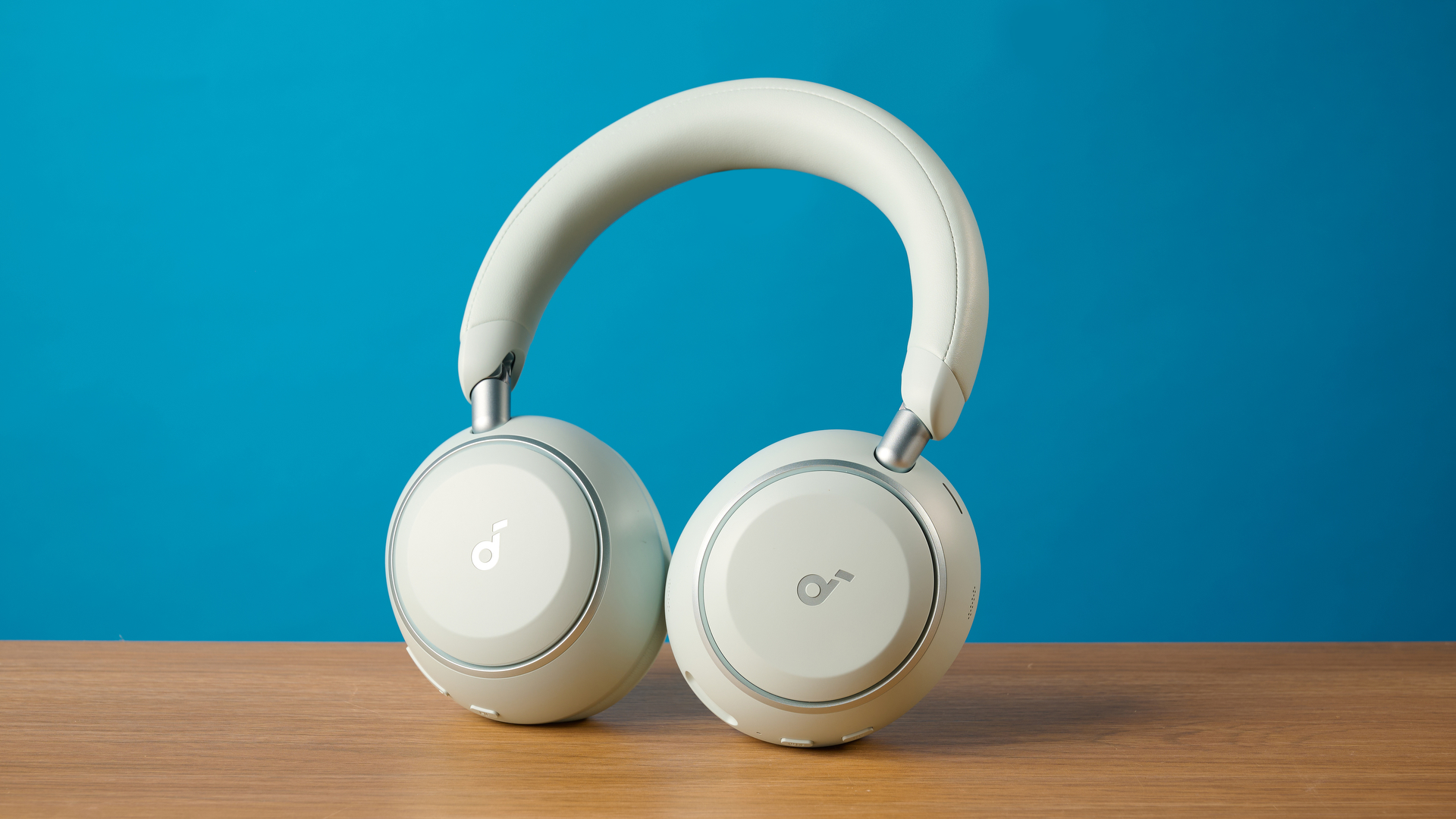 the soundcore space 2 headphones in white photographed against a blue tom's guide background