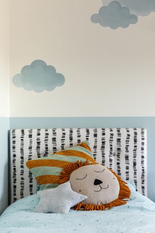 A children's bedroom with wall decals