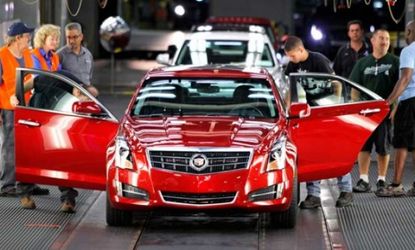 The first 2013 Cadillac ATS rolls off the assembly line at the General Motors Lansing Grand River plant on July 26.
