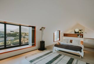 Bedroom and view at 5 Fin Whale Way, a South African holiday home by SALT Architects