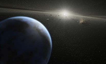 An artist's conception of asteroids in a nearby solar system: Scientists warn that an asteroid 460 feet wide could collide with Earth in 28 years.