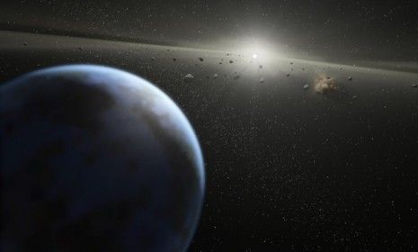 An artist&amp;#039;s conception of asteroids in a nearby solar system: Scientists warn that an asteroid 460 feet wide could collide with Earth in 28 years.