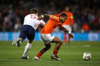 England defender John Stones (left) against Holland (PA)