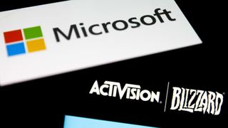 The Microsoft logo is seen on a screen, diagonally over the top of the Activision Blizzard logo