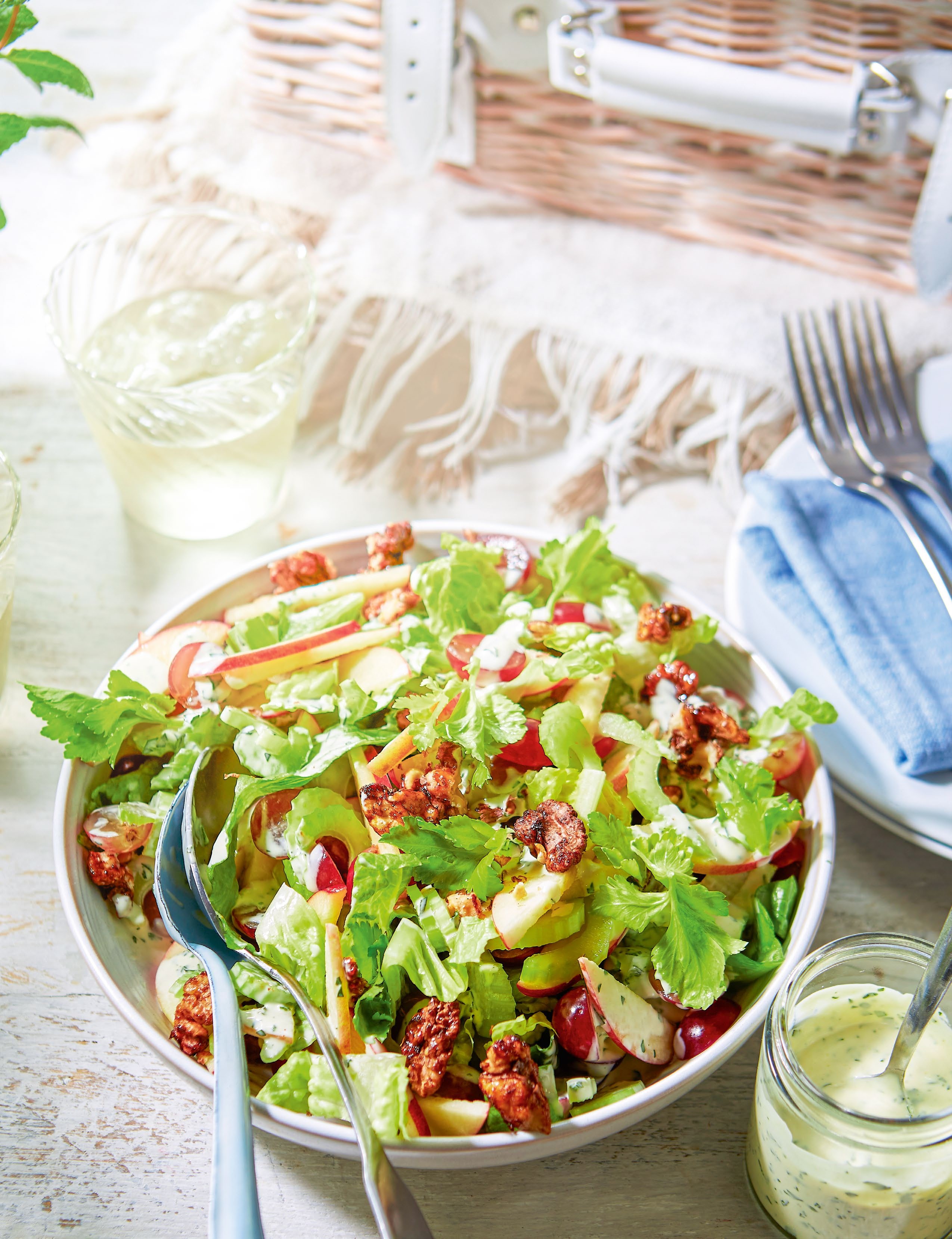 A vibrant salad featuring crunchy celery, fresh lettuce, apples, and a mustardy tarragon dressing, ideal for a posh picnic.