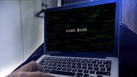 Laptop with Game Over on screen